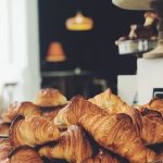 croissant on top of stainless steel tray